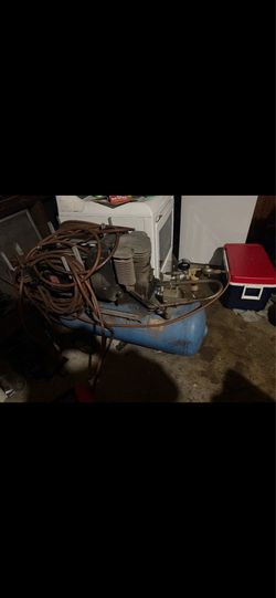 Industrial size air compressor shop air compressor has a 50 foot air hose that comes with. It runs like a champ.