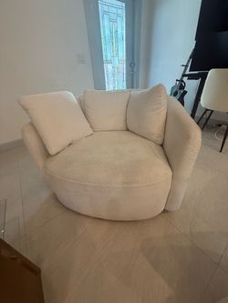 2 large swivel sofa chairs beige