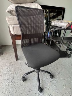Black corner desk and desk chair