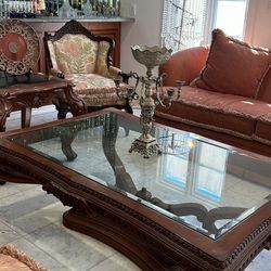 Carved wood coffee table glass top