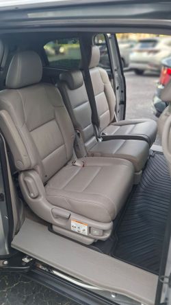 Second row, 3 seats for Honda odyssey. Matches year 2011 through 2017. Light gray leather.