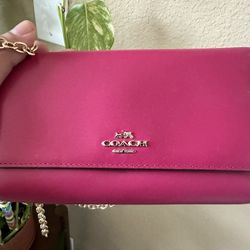 Pink Coach crossbody wallet