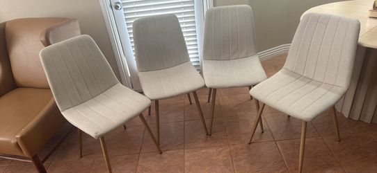 4 beige dining chairs