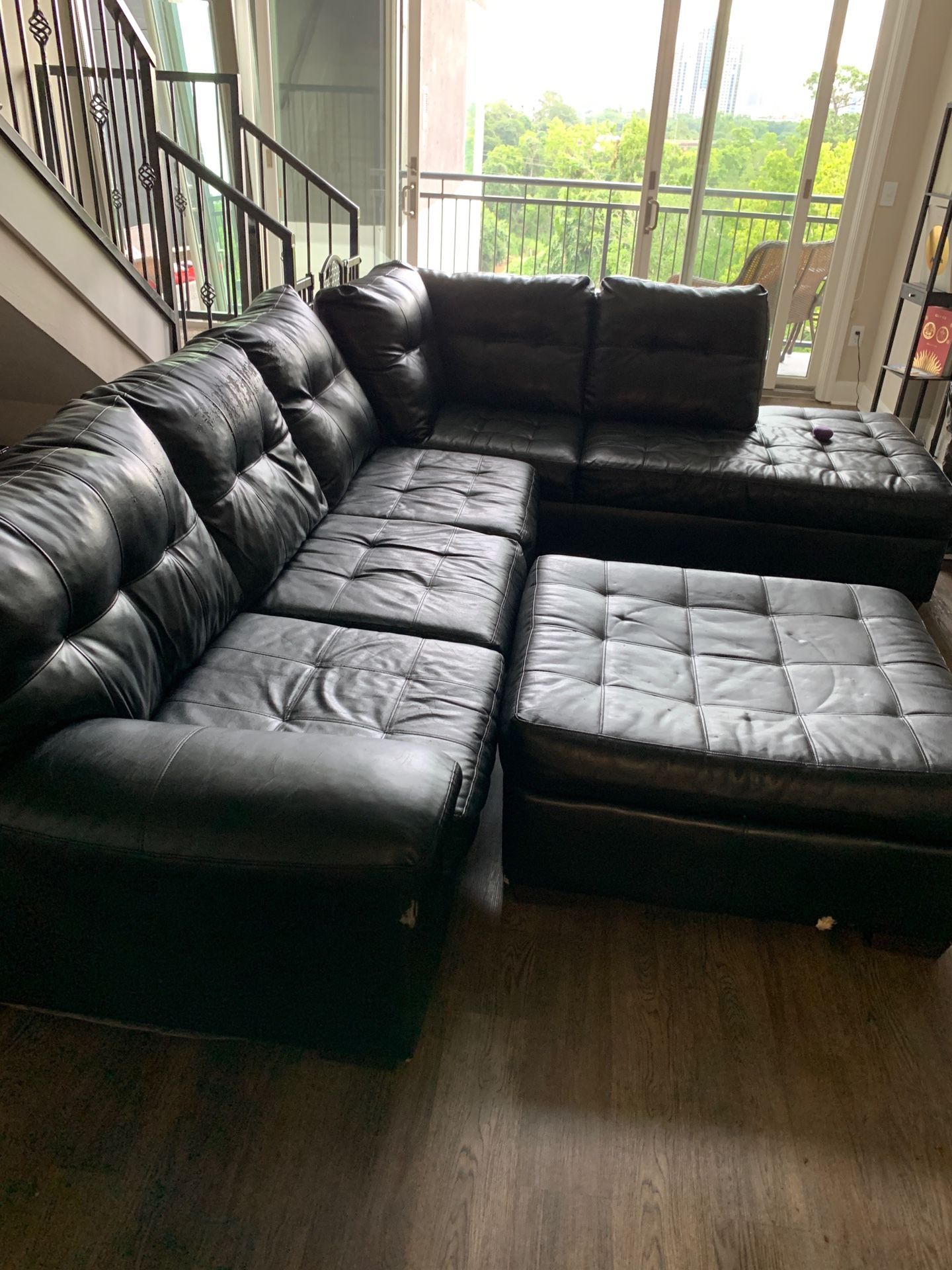 Black leather sectional couch