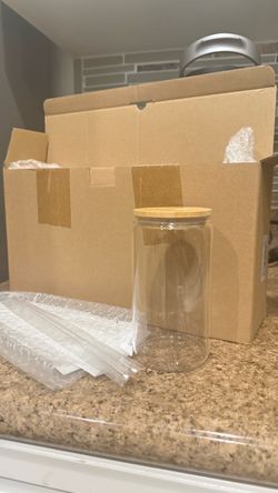 glasses with glass straw and lid