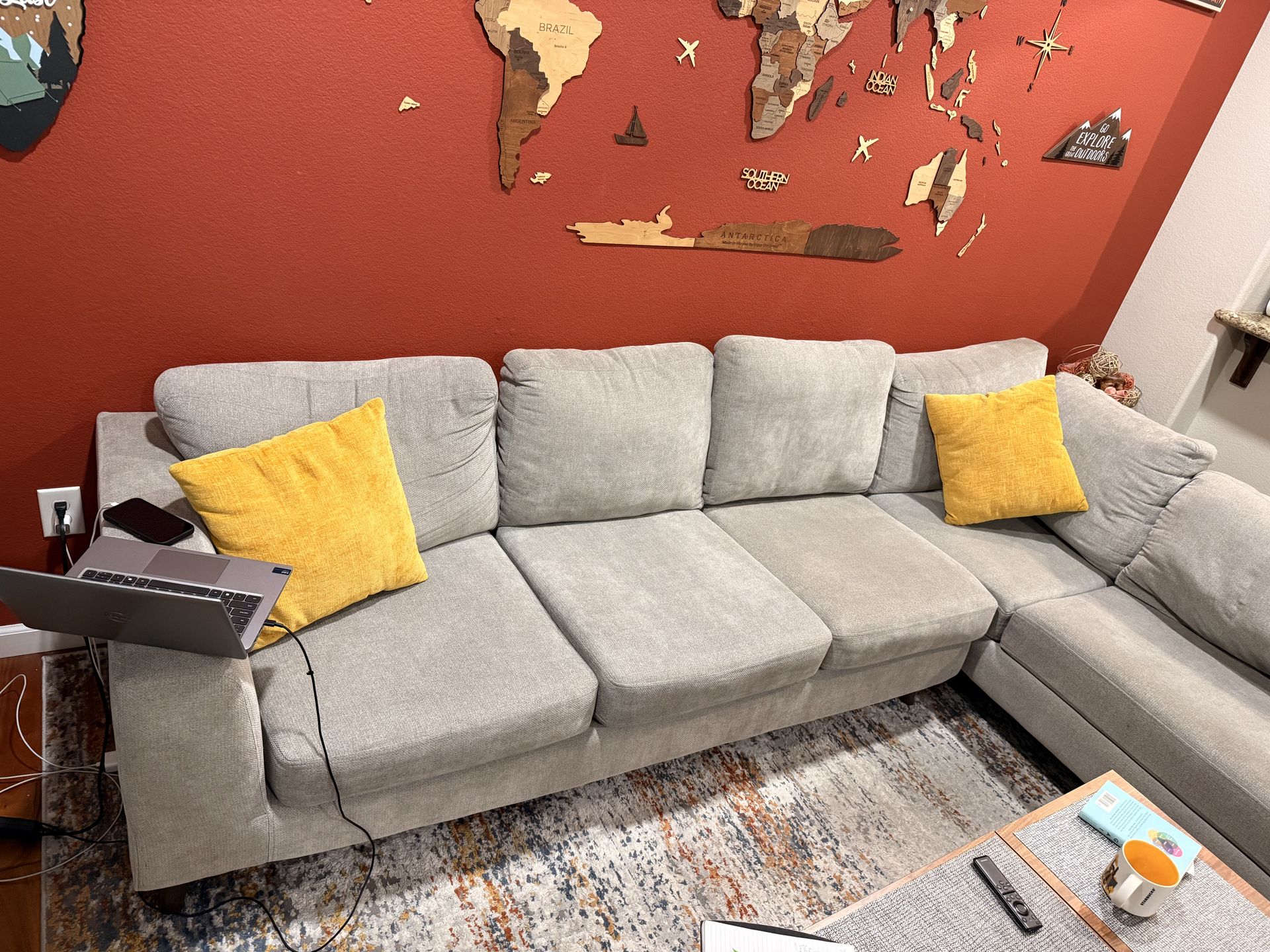 Grey sectional couch (pillows and coffee table not included )