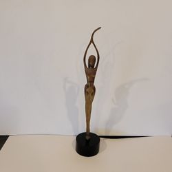 Vintage Mid-Century Modern (MCM) brass sculpture of an elongated female 
figure , often referred to as a "Ballerina" or "Dancer".
The sculpture featur