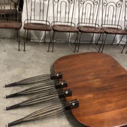 40”dx70”wx30”h Heavy strong special wood with metal table and six chairs for outside