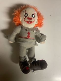Small Chucky plushie and poster.