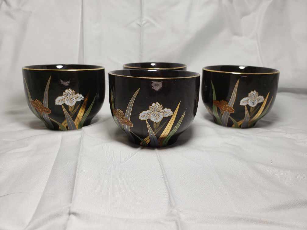 Vintage Ottagiri japan tea cups black with floral design good condition and smoke free home.  Measures  2 1/2" T X 3" W .