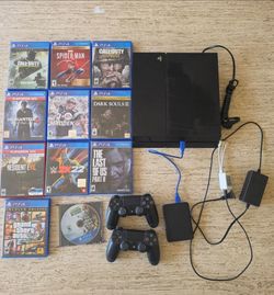 Sony Playstation 4 Bundle,  12 games and 2 controllers