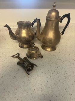 Vintage tea pot /coffee pot and vintage corkscrew.