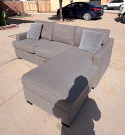 Free Delivery!! Only one year hold cleaned Sectional Couch with Storag