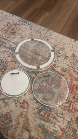 Drum heads 8, 12, 14, 18