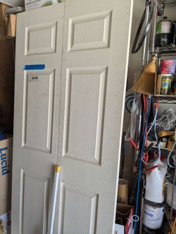 Bifold door with new hanging hardware