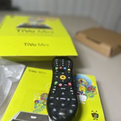 TiVo TCDA93000 Mini Receiver With Voice Remote Loaded With Extras. Used in good condition with minor cosmetic blemishes these blemishes are limited to