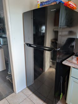Black Frigidaire Top-Freezer Refrigerator