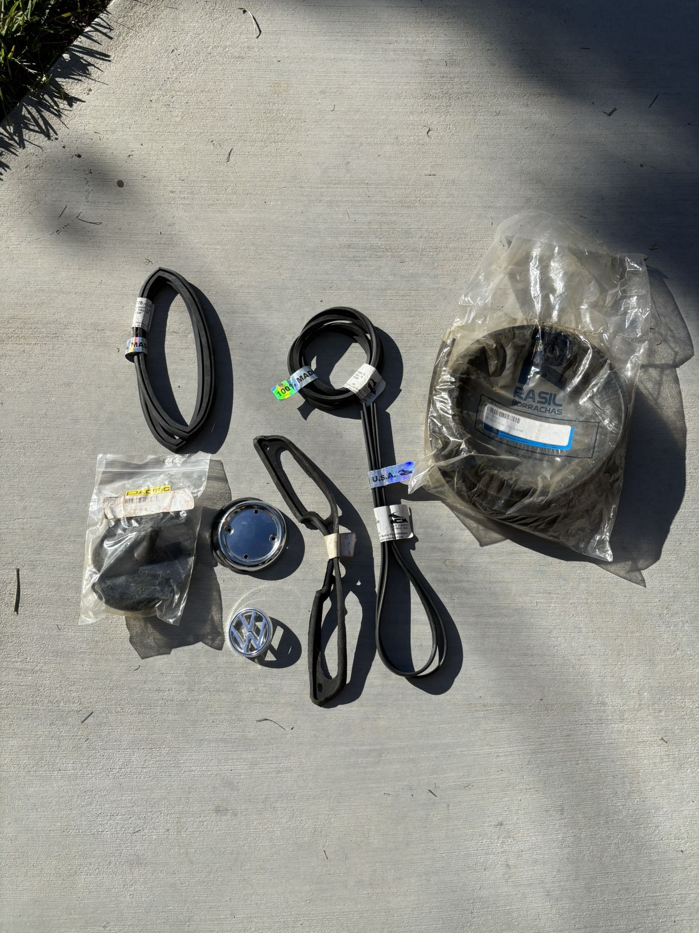 Karmann Ghia exterior rubber and hood emblem base. 