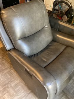 Heated massaging recliner