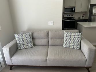 Gray fabric sofa- room to go style