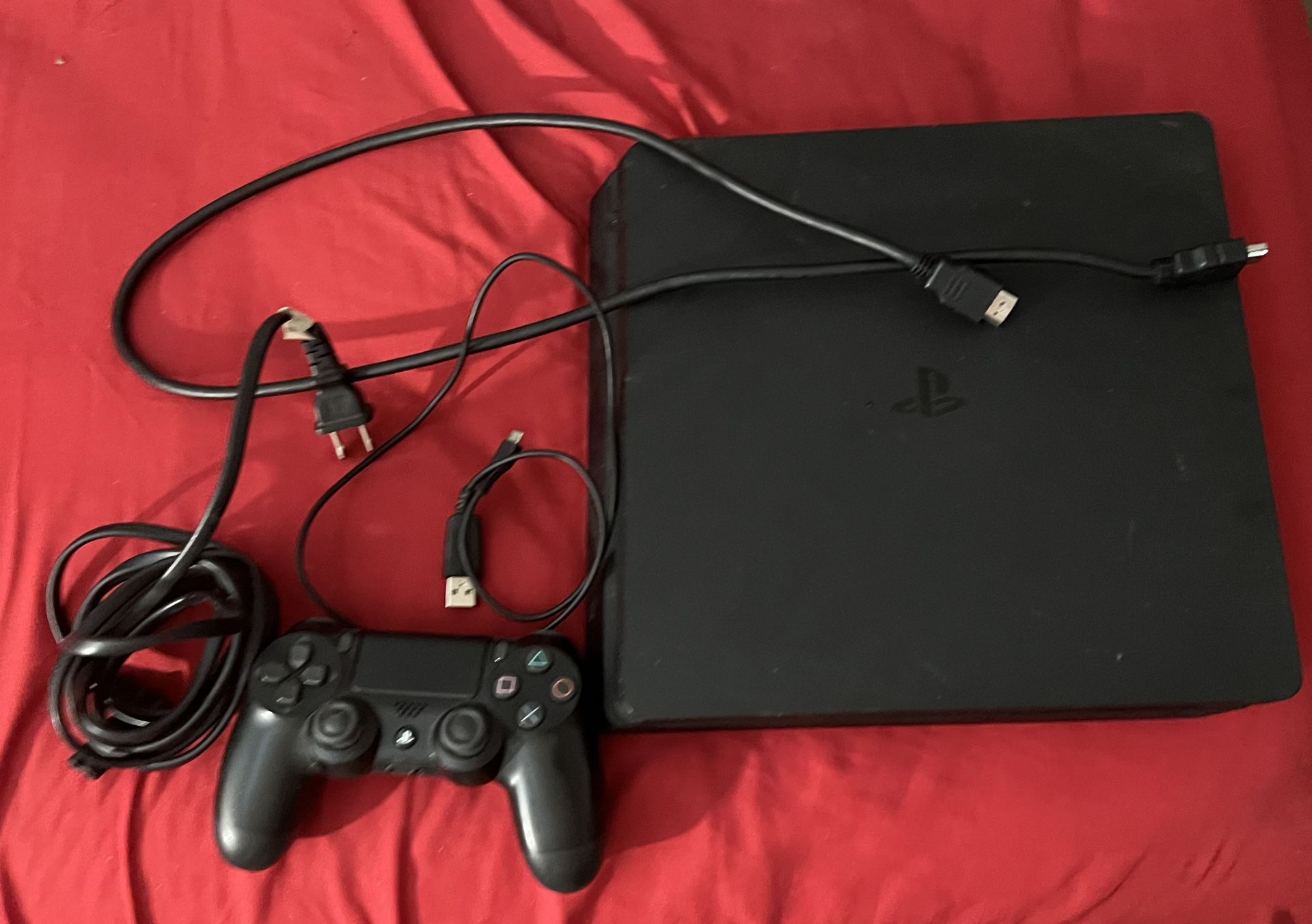 ps4 with one wireless controller and two games