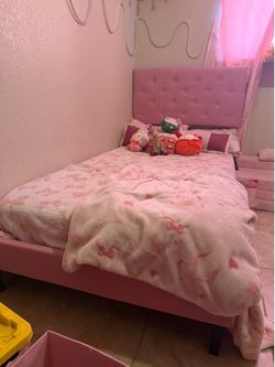 Pink twin bed with mattress