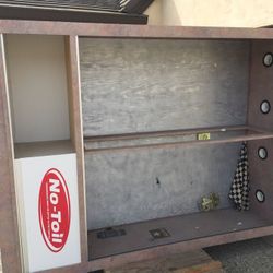 Cabinet with sliding glass doors and built in lights .