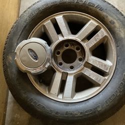 4 Used Ford Tires And Rims And Hubcap
