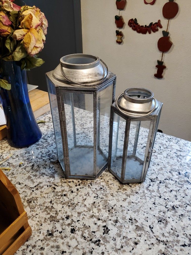 Both  Lanterns / Small Lantern  Is Missing A Glass