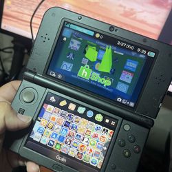 Loaded Black Nintendo “New” 3DS XL w/Hshop + 128gb SD Card