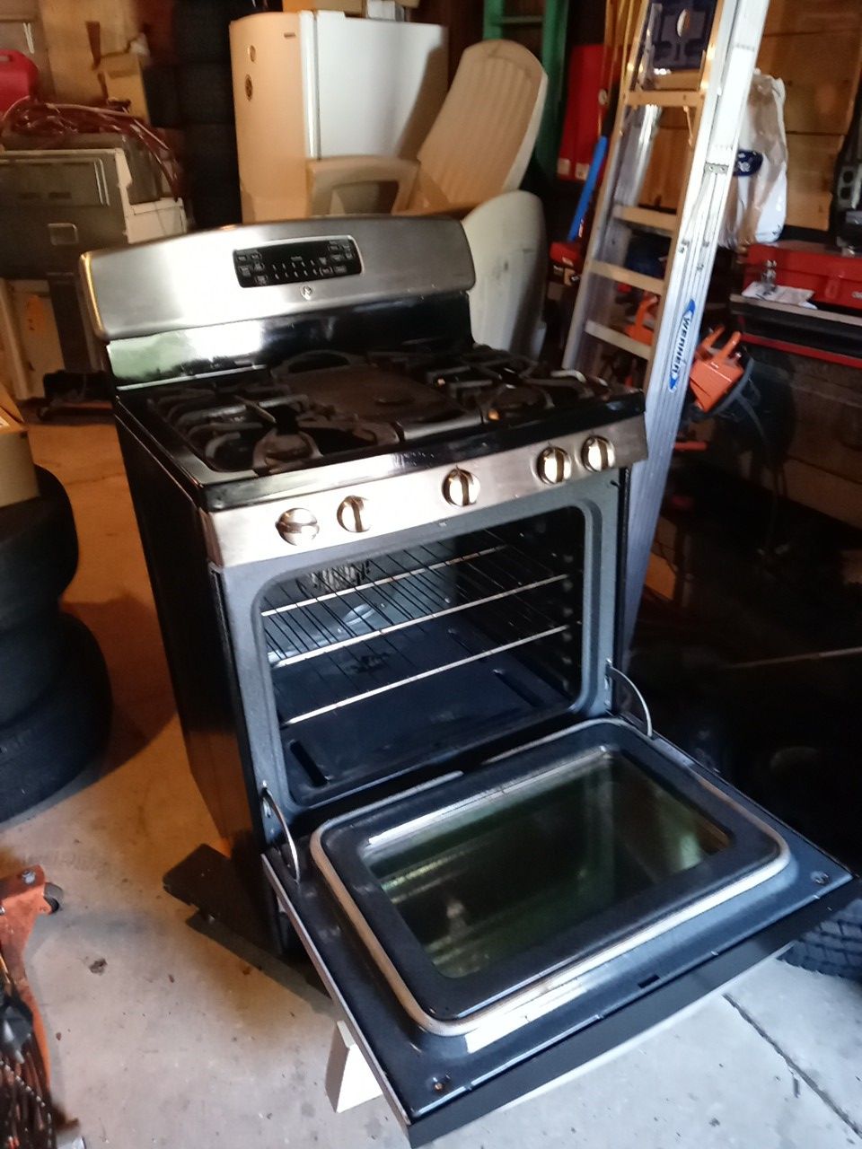 GE gas stove with center griddle.