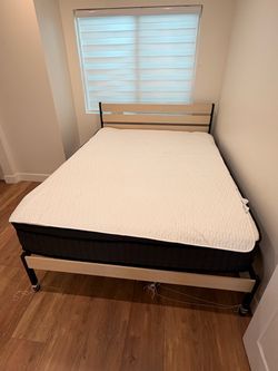 Two queen bed frames and a queen mattress
