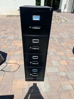 4 Drawer metal filing cabinet.  2 available