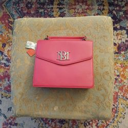 Badgley Mischka Flap Crossbody Bag featuring a prominent silver-toned logo on the front. (Pink)