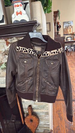 Woman’s cute pleather/leopard jacket
