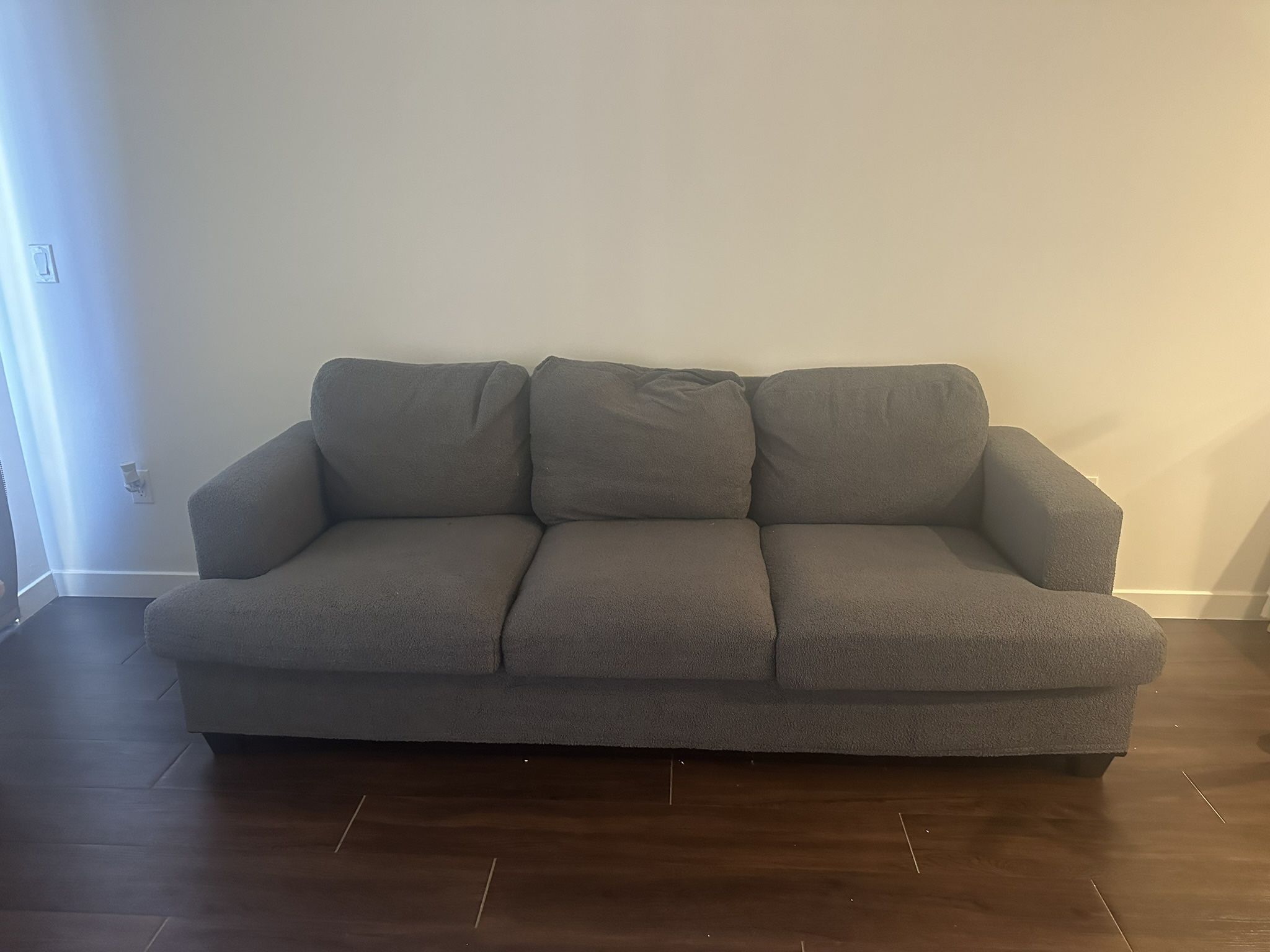 Rarely used 3 seater grey couch
