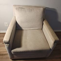 Tan chair with ottoman