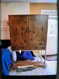 New bar cabinet wood w/ mirror caracole light  design