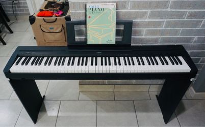 Yamaha P71 88-key digital piano. Barely used. Comes with stand, cover, introductory booklet, power supply, and sustain pedal.