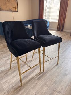2 black velvet/gold bar chairs