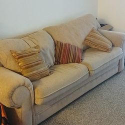 Sofa Bed  And A Patio Table 