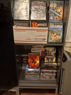 DVD  for sale . I Have 100 of DVD  I'm sale for 2 Dollars  Ea ch