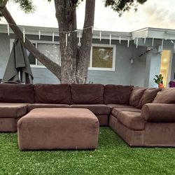 Brown U-shaped sofa with ottoman 