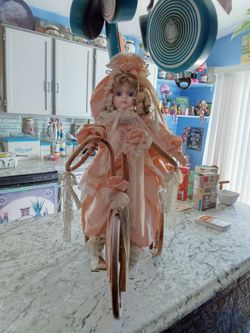 Doll on bike