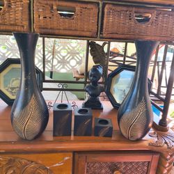 Vintage black carved wooden vases and candle holders with a palm leaf motif