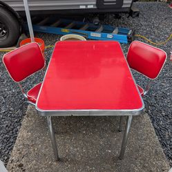 This is a child's size, table and chairs