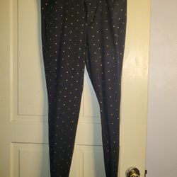 These Old Navy Women's Black Golden Polka Dot Pixie Mid-Rise Pants in size 8 are a stylish addition to any wardrobe. Made from a comfortable cotton bl