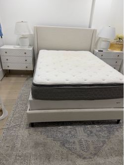 White bed frame and mattress set
