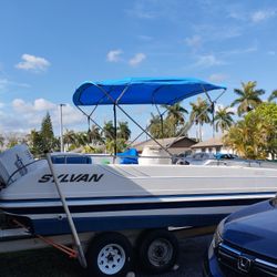 Sylvan 2030 . Outboard 150 HP, Working Good.2 Replacement Engines.And Trailer