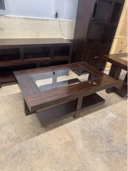 Modern dark wood coffee table with glass inserts